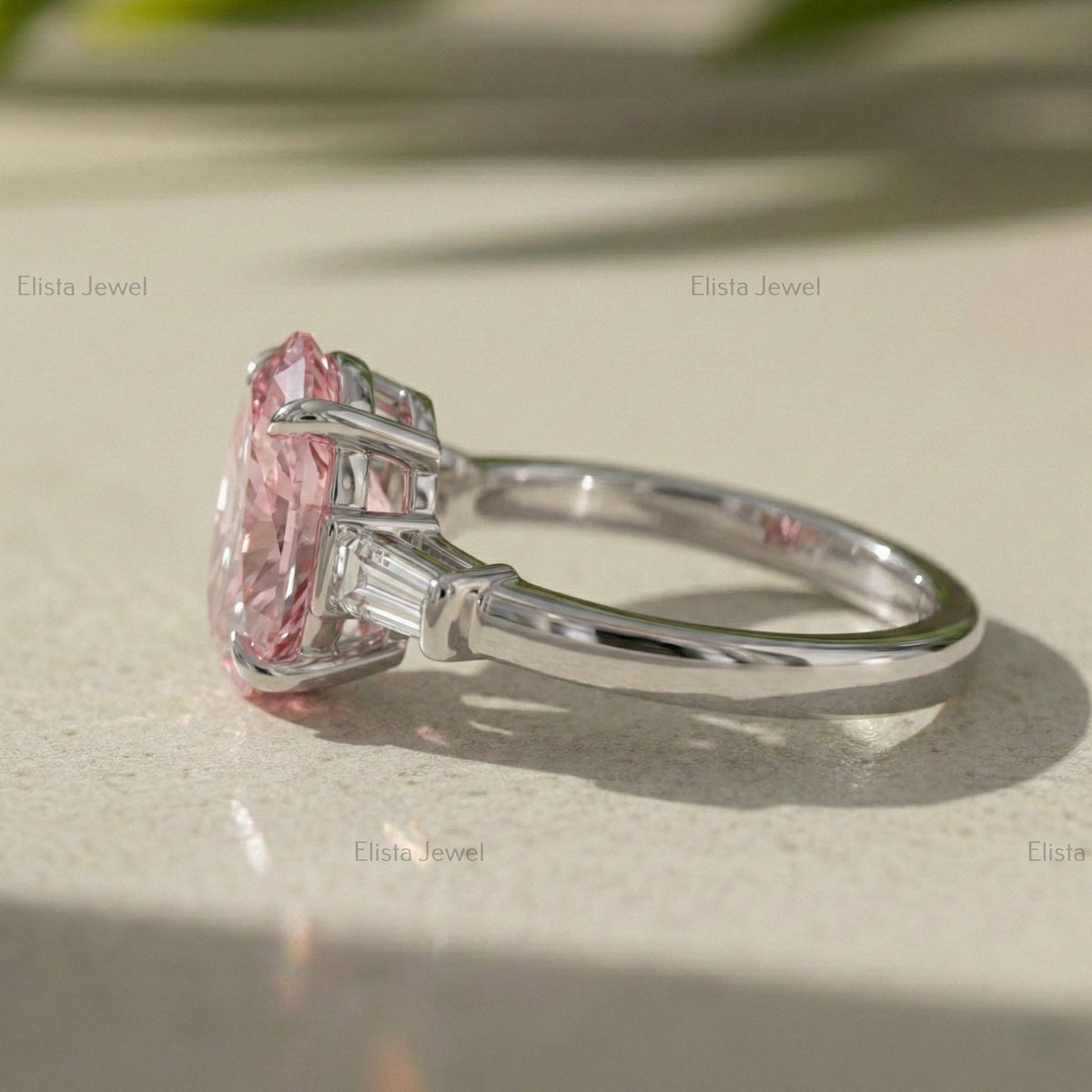 Oval Lab Grown Pink Diamond Three Stone Engagement Ring With Tapered Baguette Side Stones