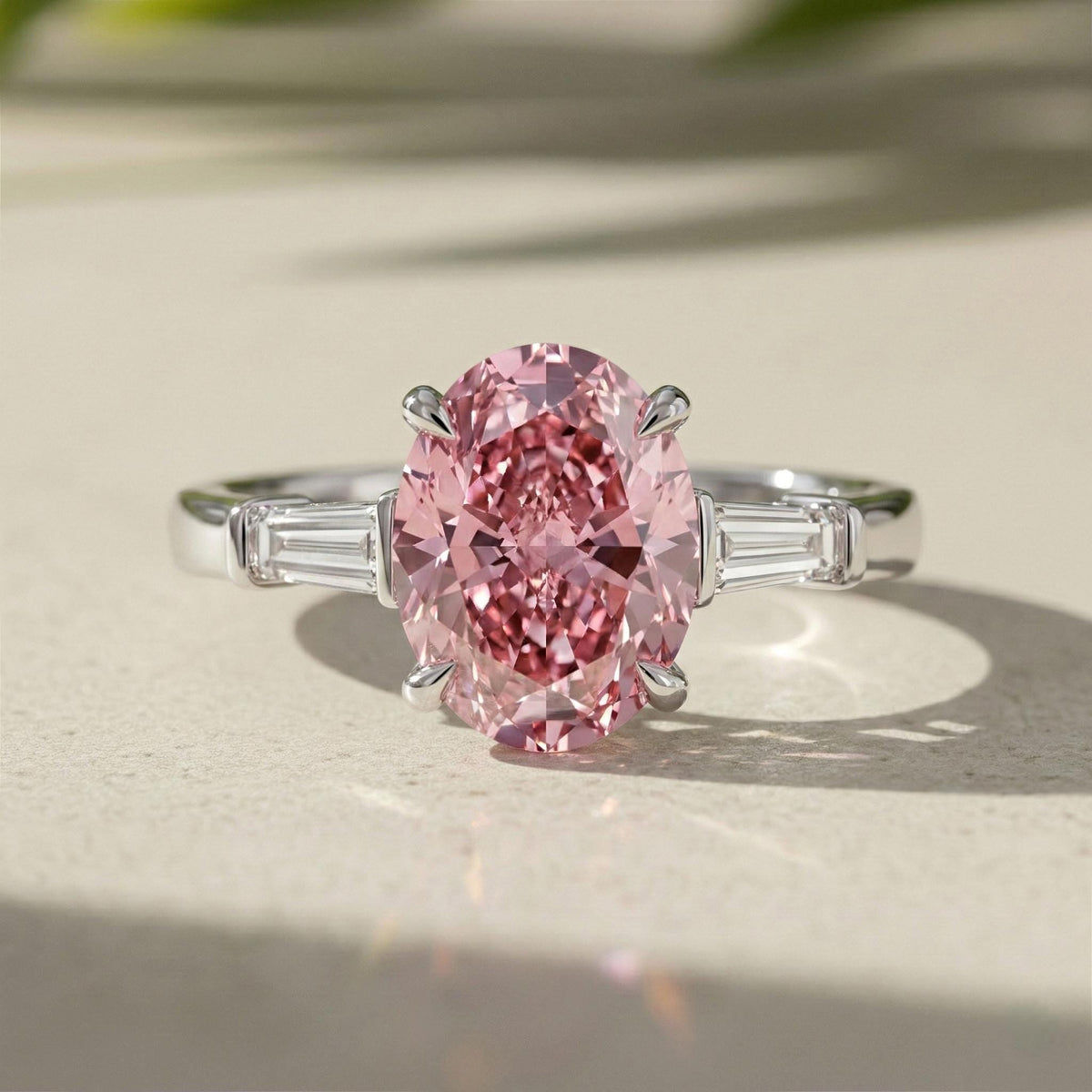 Oval Lab Grown Pink Diamond Three Stone Engagement Ring With Tapered Baguette Side Stones