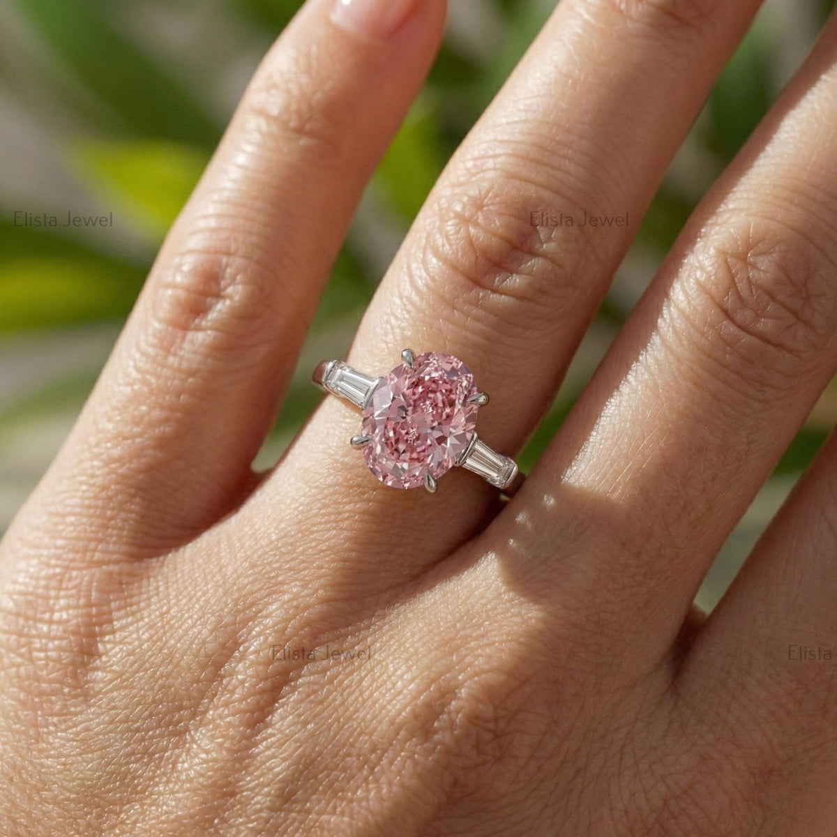 Oval Lab Grown Pink Diamond Three Stone Engagement Ring With Tapered Baguette Side Stones