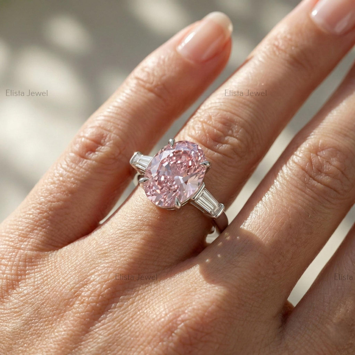 Oval Lab Grown Pink Diamond Three Stone Engagement Ring With Tapered Baguette Side Stones