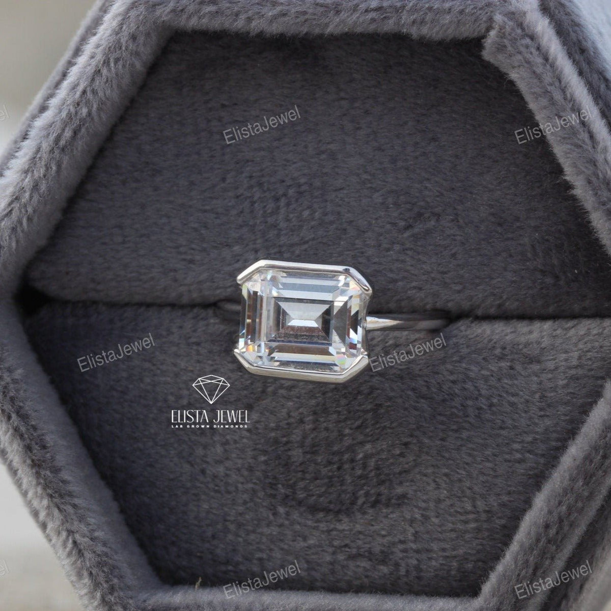 East West Emerald Cut Bezel Solitaire Lab Grown Diamond Ring - Ring on Hand View