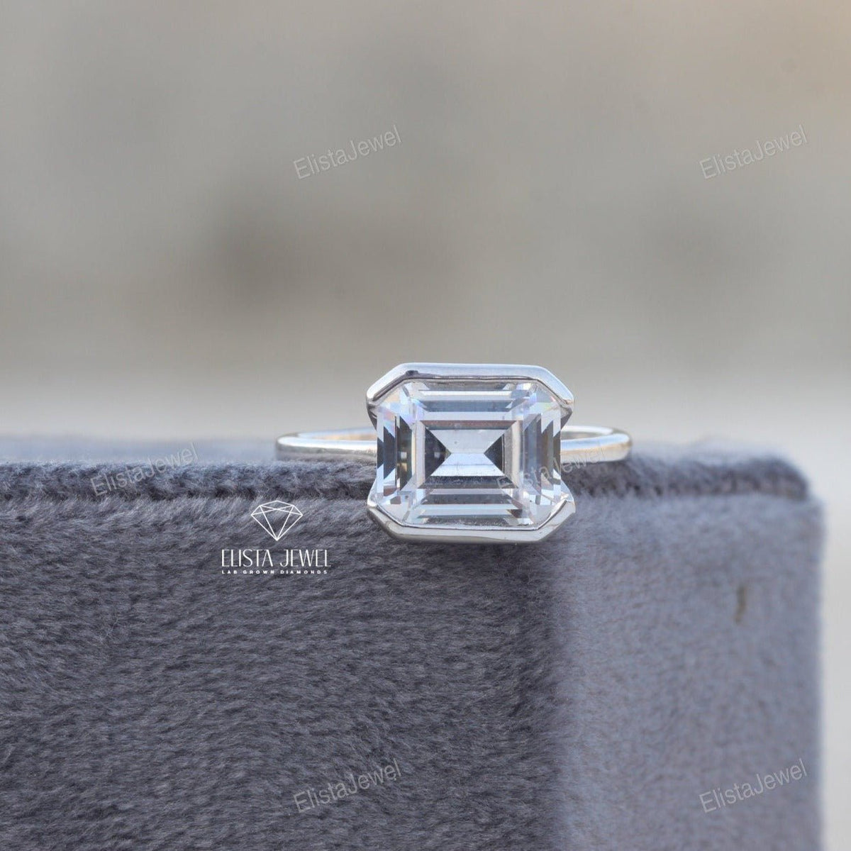 East West Emerald Cut Bezel Solitaire Lab Grown Diamond Ring in 10K - Front View