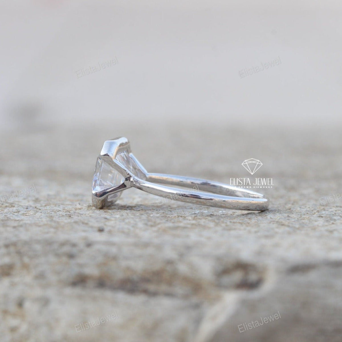 East West Emerald Cut Bezel Solitaire Lab Grown Diamond Ring - Close-up View