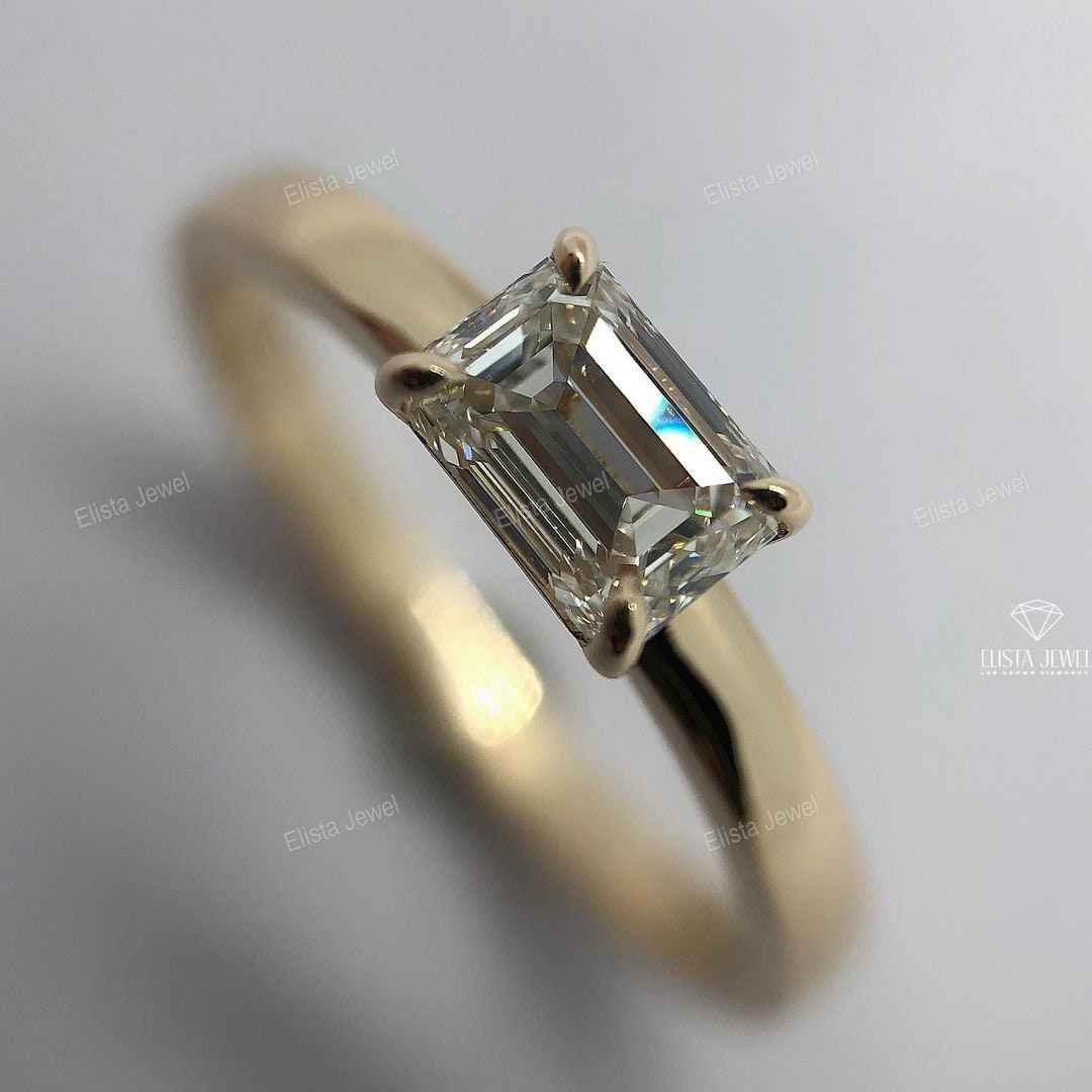 East West Emerald Cut Solitaire Ring