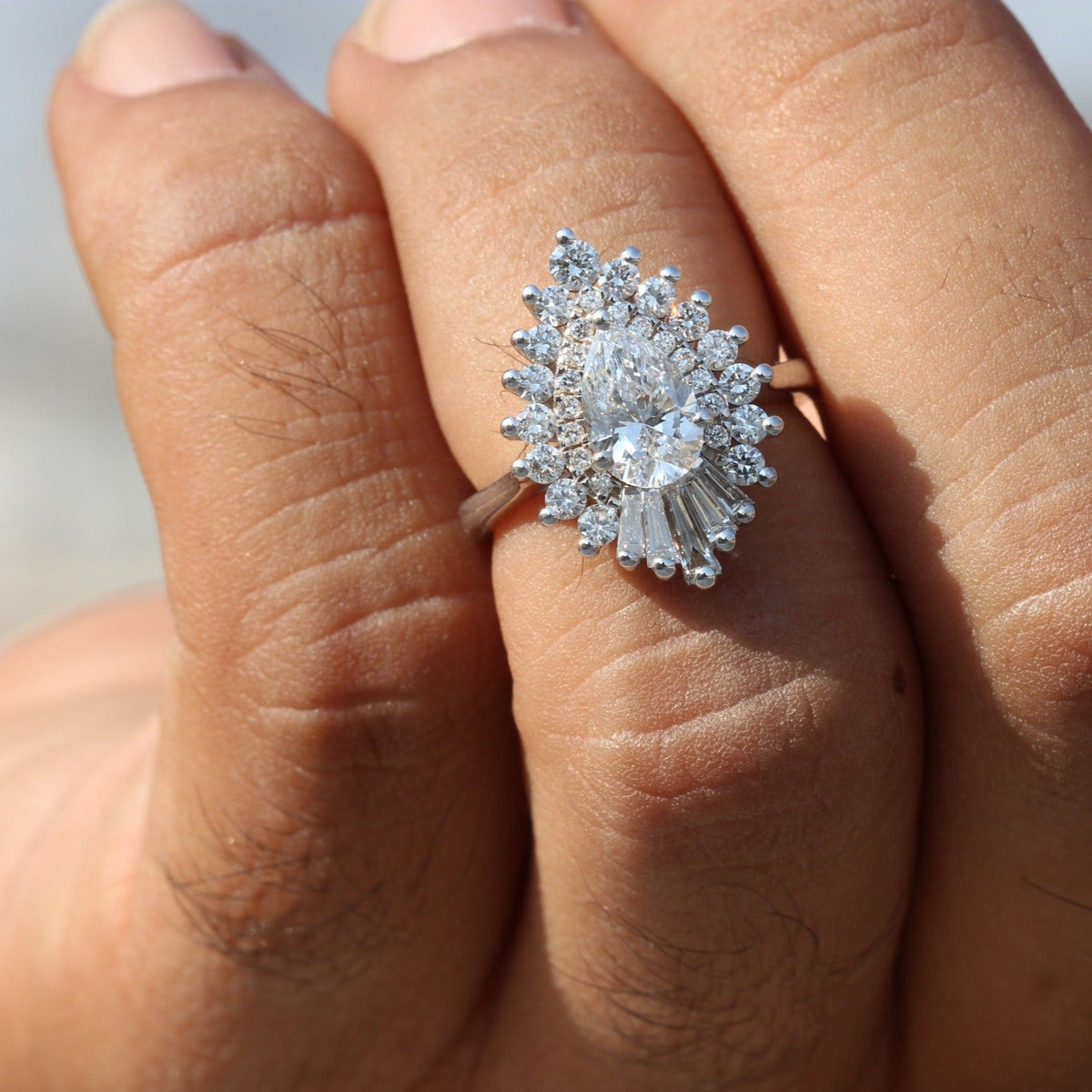 Pear Cut Diamond Starburst Ring - Ring on Hand View