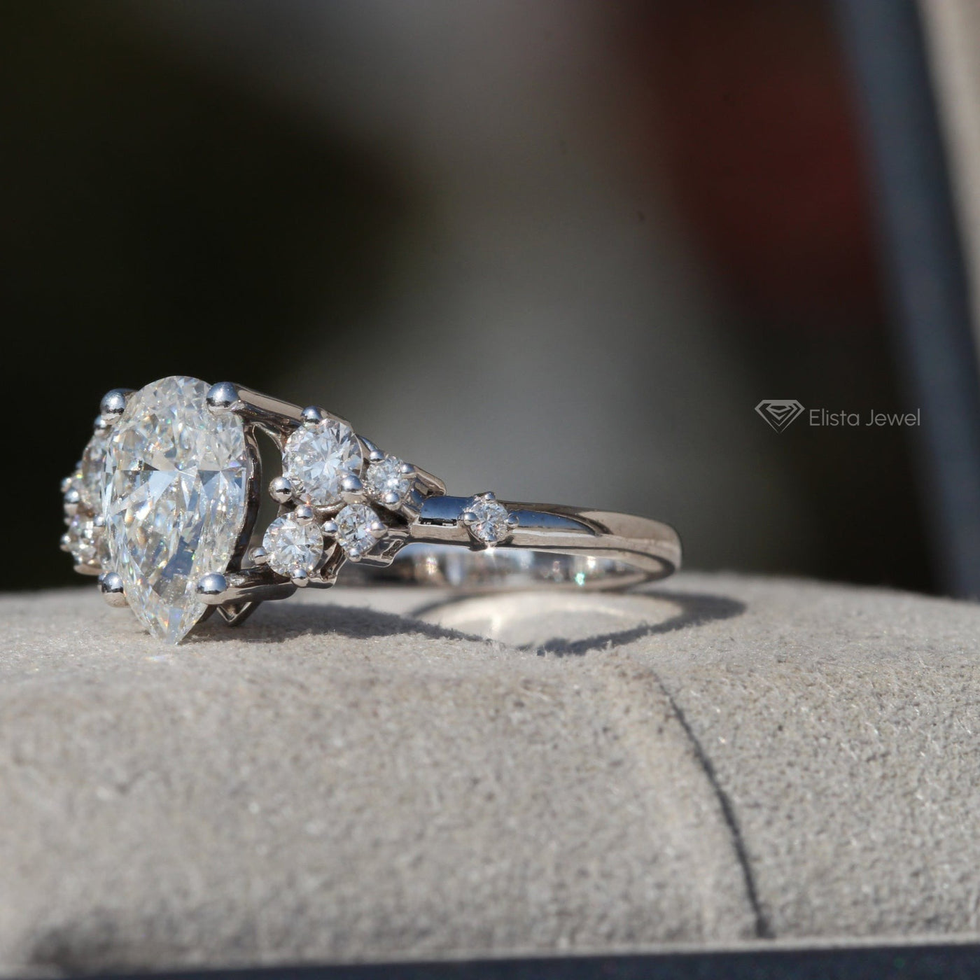 Pear Cut Solitaire Accent Engagement Ring