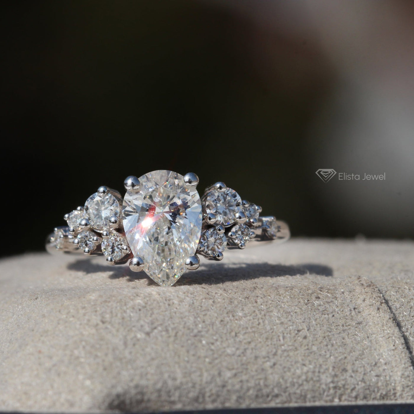 Pear Cut Solitaire Accent Engagement Ring