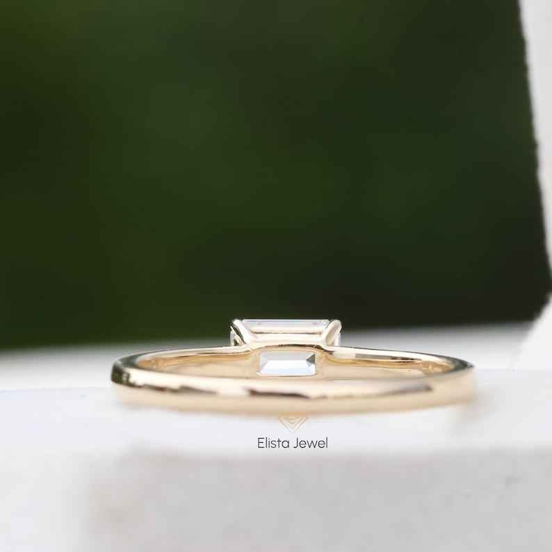 East West Emerald Cut Solitaire Ring