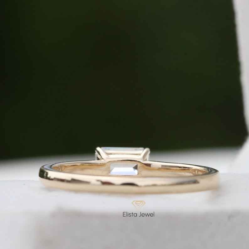 East West Emerald Cut Solitaire Ring