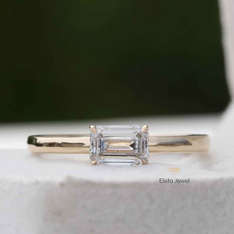 East West Emerald Cut Solitaire Ring