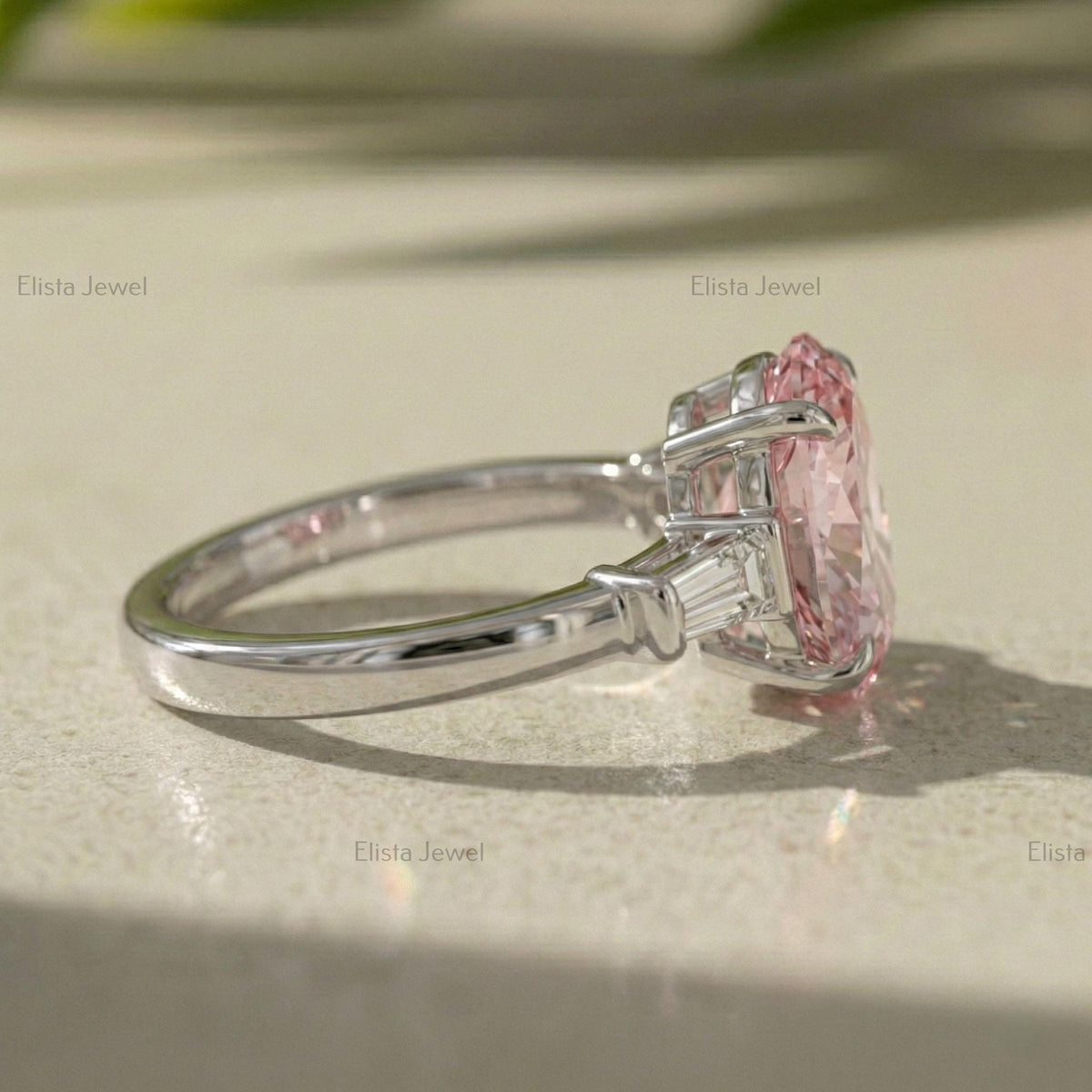 Oval Lab Grown Pink Diamond Three Stone Engagement Ring With Tapered Baguette Side Stones