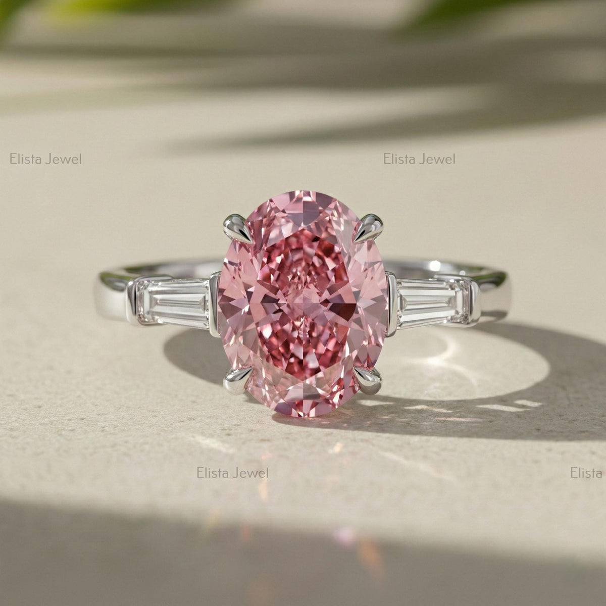 Oval Lab Grown Pink Diamond Three Stone Engagement Ring With Tapered Baguette Side Stones