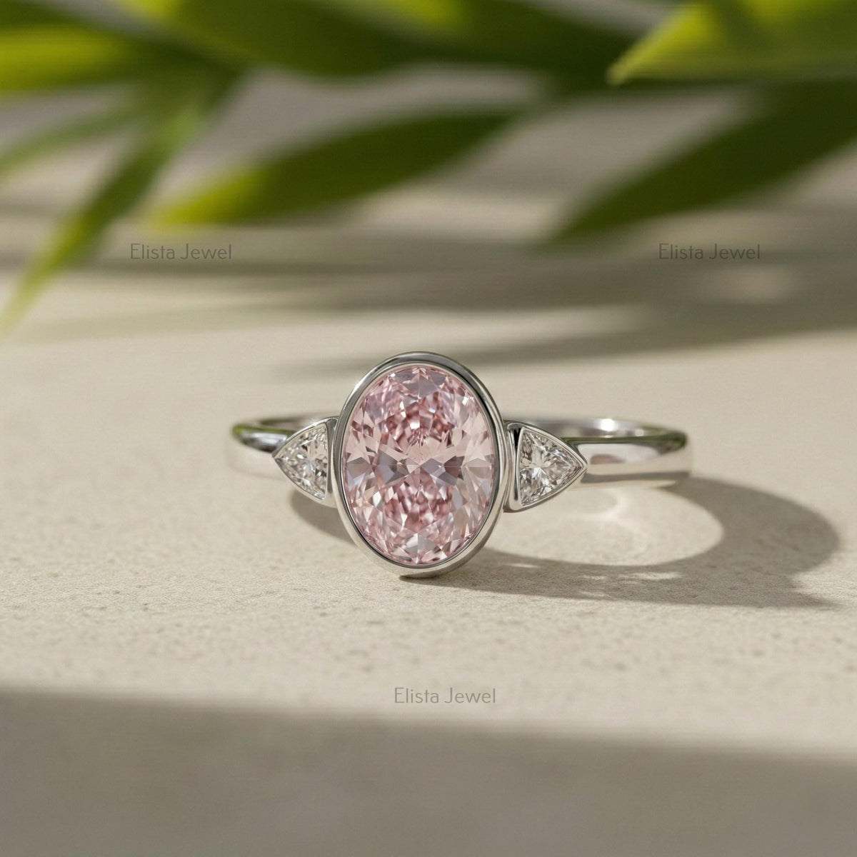Oval Lab Grown Diamond Pink Three Stone Bezel Engagement Ring