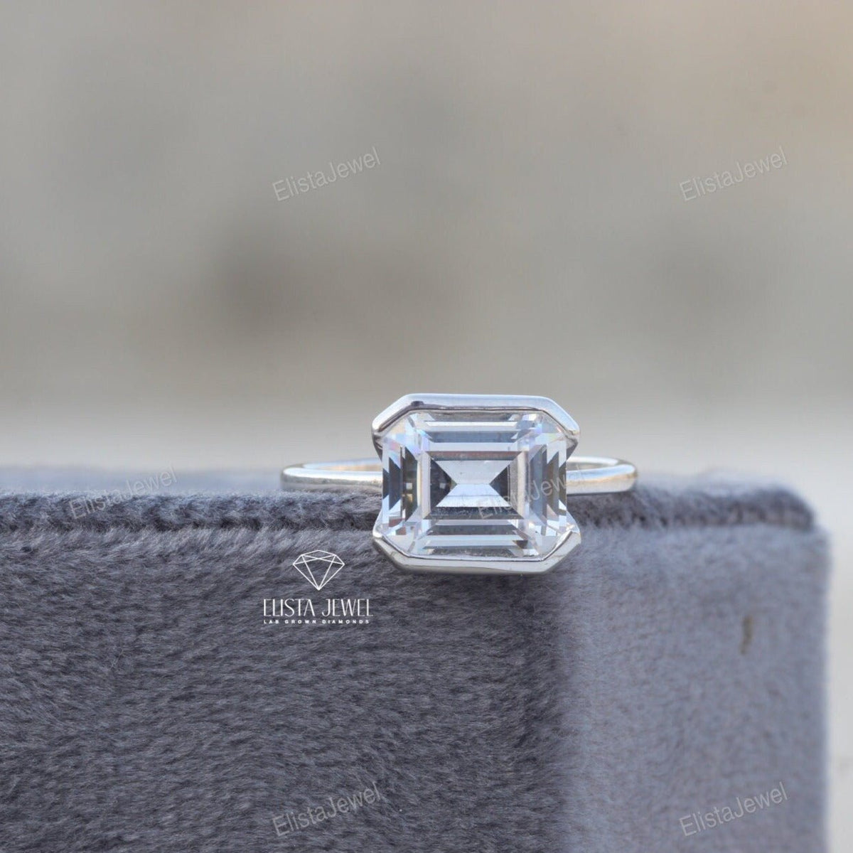 East West Emerald Cut Bezel Solitaire Lab Grown Diamond Ring - Perspective View