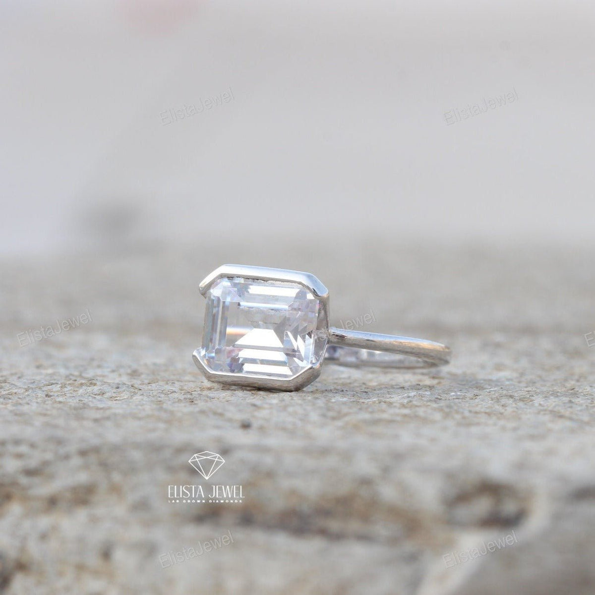 East West Emerald Cut Bezel Solitaire Lab Grown Diamond Ring in Platinum - Top View