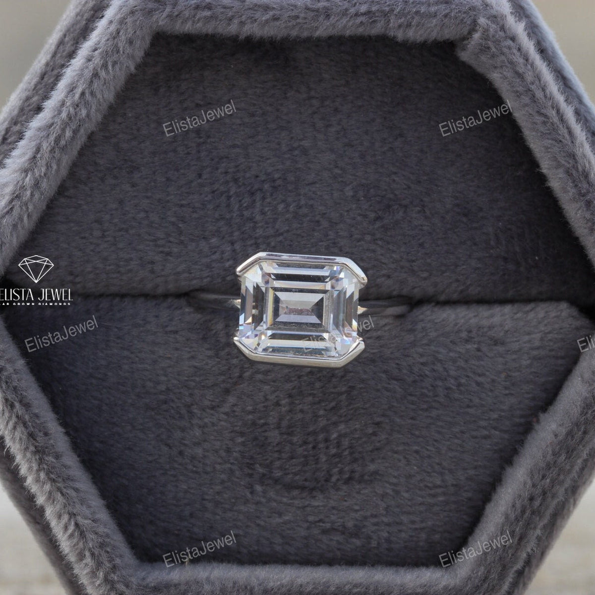 East West Emerald Cut Bezel Solitaire Lab Grown Diamond Ring in 18K - Angled View