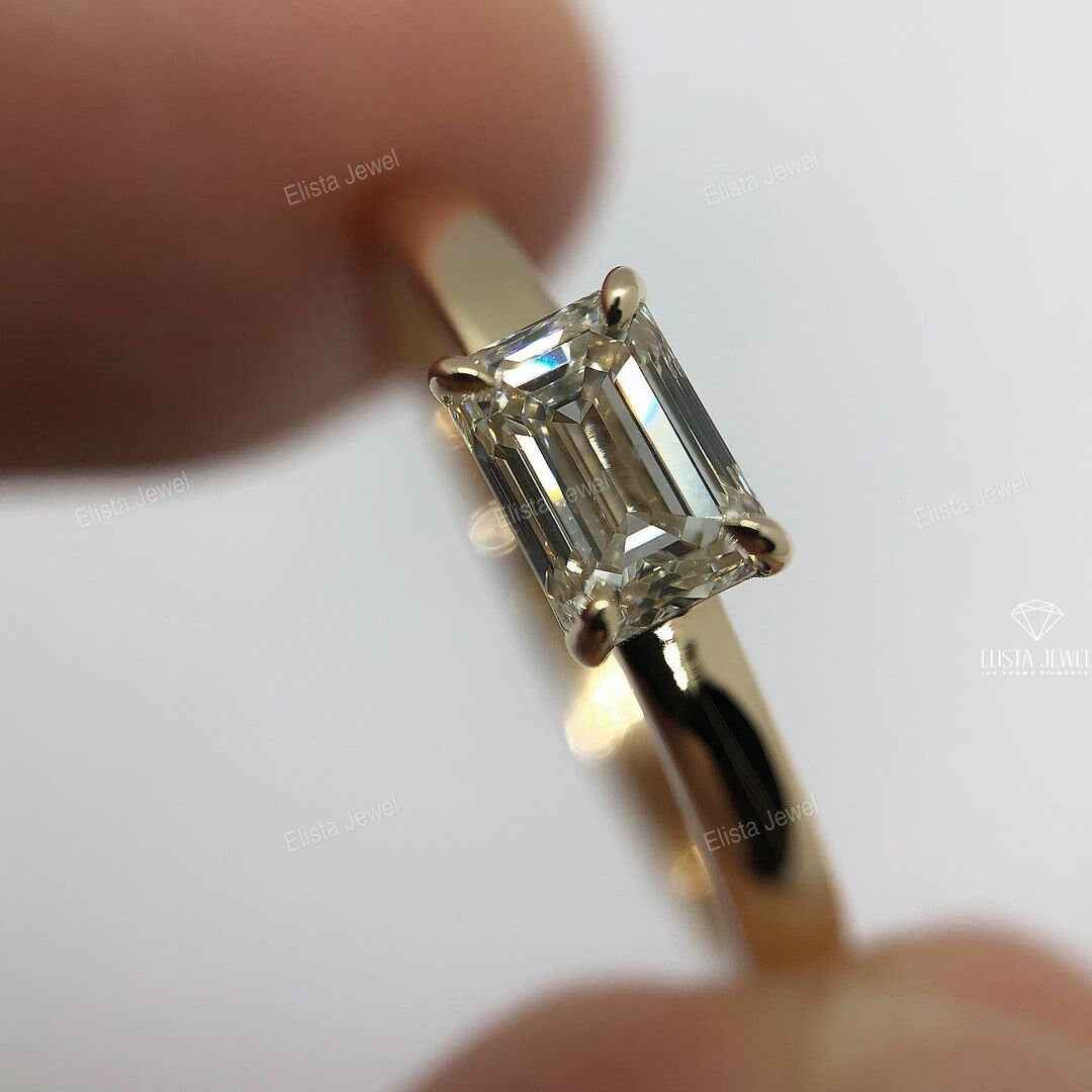 East West Emerald Cut Solitaire Ring