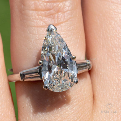 Pear Cut Three Stone Engagement Ring