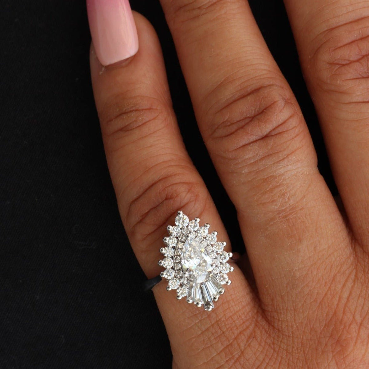 Pear Cut Diamond Starburst Ring in 18K - Angled View