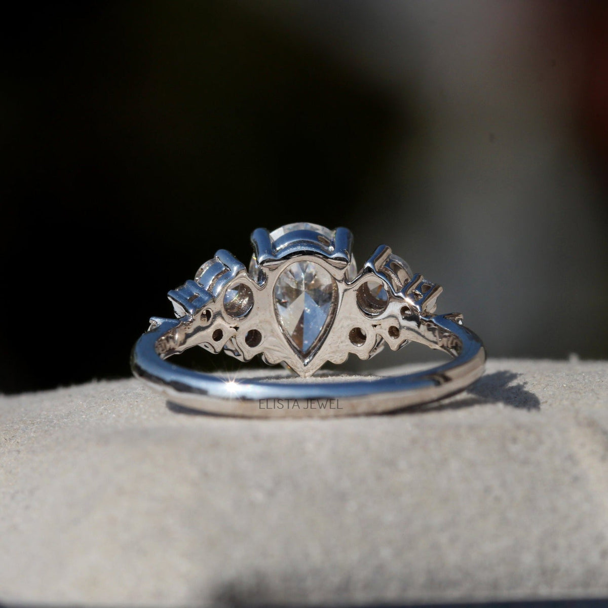 Pear Cut Solitaire Accent Engagement Lab Grown Diamond Ring in Platinum - Top View